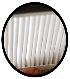 A close up photograph of a clean, new air filter