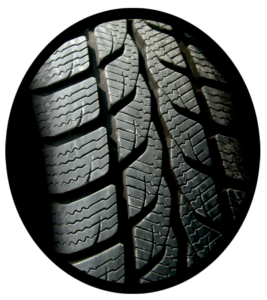 A new automobile tire showing deep treads