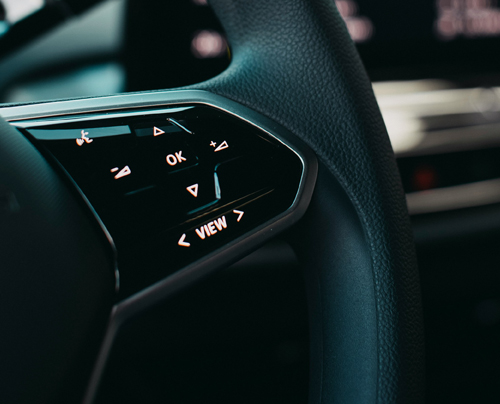 The hand controls on an automobile steering wheel