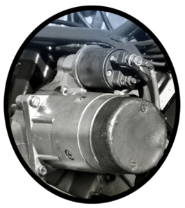 An automobile starter on an engine