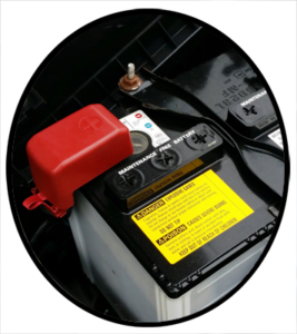 A newly installed battery in an automobile engine