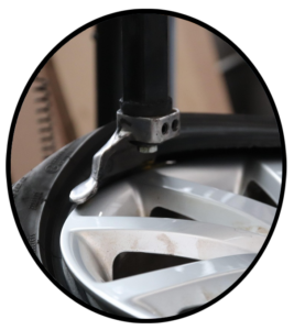 An automobile tire being mounted on a rim