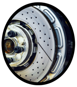 An automobile tire removed exposing the automobile brake system