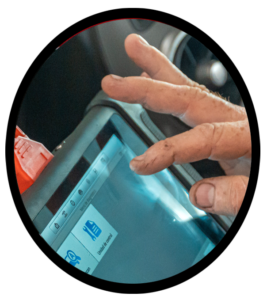 A mechanic running an automobile diagnostic examination