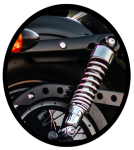 The suspension springs on the back tire of a motorcycle